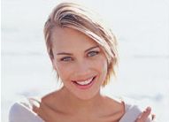 Smiling blond woman on beach
